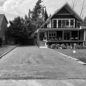 Two-story house with balcony and driveway